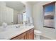 Bright bathroom featuring a single vanity, toilet and shower at 953 Wagner Valley St, Henderson, NV 89052