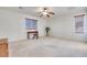 Bright, open bedroom with natural light, ceiling fan and carpeted floors at 953 Wagner Valley St, Henderson, NV 89052