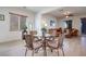 Dining area with seating for four, ceiling fan, natural lighting, and hardwood flooring at 953 Wagner Valley St, Henderson, NV 89052