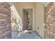 Welcoming entryway with stone accents, neutral tones, and a glimpse into the home's interior at 953 Wagner Valley St, Henderson, NV 89052