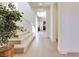 Bright foyer featuring hardwood floors, staircase, and a plant adding a touch of nature at 953 Wagner Valley St, Henderson, NV 89052