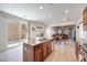 Open kitchen features granite countertops, stainless steel appliances, island and access to the living room at 953 Wagner Valley St, Henderson, NV 89052