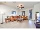 Bright living room with ceiling fan, hardwood floors, neutral paint, and natural lighting at 953 Wagner Valley St, Henderson, NV 89052