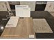 Design layout featuring sleek chrome kitchen faucet and luxurious vinyl plank in Toasted Taupe at 9548 Hinson St, Las Vegas, NV 89139