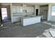 Bright kitchen featuring white cabinets, a center island, and ample counter space at 9548 Hinson St, Las Vegas, NV 89139