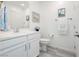 Bright bathroom with white cabinetry, modern fixtures, and soothing neutral tones at 965 Nevada State Dr # 35101, Henderson, NV 89002