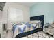 Cozy bedroom with plush carpeting, stylish decor, and plenty of natural light at 965 Nevada State Dr # 35101, Henderson, NV 89002