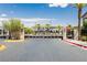 Gated community featuring a pool area with palm trees and a meticulously maintained surrounding landscape at 965 Nevada State Dr # 35101, Henderson, NV 89002