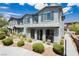 Charming two-story townhome with stucco exterior, landscaped front yard, covered porch, and inviting curb appeal at 965 Nevada State Dr # 35101, Henderson, NV 89002