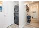 Convenient laundry area with stacked washer and dryer, hallway entrance at 965 Nevada State Dr # 35101, Henderson, NV 89002