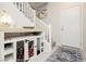 Hallway features a modern dog crate built into the stairs and a coastal beach theme at 965 Nevada State Dr # 35101, Henderson, NV 89002