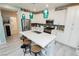 Spacious kitchen boasts a large island, stainless steel appliances, and stylish lighting fixtures with modern countertops at 965 Nevada State Dr # 35101, Henderson, NV 89002
