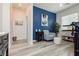 Cozy living room area features a blue accent wall, comfortable seating, and a stylish decor that's perfect for relaxing or entertaining at 965 Nevada State Dr # 35101, Henderson, NV 89002