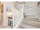 Beautiful staircase with modern white railings and decorative wood wall at 965 Nevada State Dr # 35101, Henderson, NV 89002