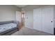 Comfortable bedroom with twin beds, carpeted floor, and a closet with mirrored doors at 9990 Perth Ct, Las Vegas, NV 89141