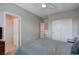 Comfortable bedroom with neutral walls, ceiling fan, and a double door closet, offering ample storage space at 9990 Perth Ct, Las Vegas, NV 89141