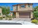 Charming two-story home featuring a well-manicured front yard and inviting curb appeal at 9990 Perth Ct, Las Vegas, NV 89141