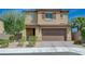 Charming two-story home featuring a well-manicured front yard and inviting curb appeal at 9990 Perth Ct, Las Vegas, NV 89141