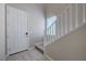 Welcoming foyer with a white front door and staircase, creating an inviting first impression at 9990 Perth Ct, Las Vegas, NV 89141