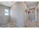 Hallway featuring neutral walls, plush carpet, and decorative picture frames, creating a cozy transition space at 9990 Perth Ct, Las Vegas, NV 89141