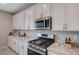 Kitchen with granite countertops, stainless steel appliances, and ample storage space at 9990 Perth Ct, Las Vegas, NV 89141
