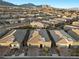 An aerial view shows a residential neighborhood with mountain views at 12476 Heritage Bend Dr, Las Vegas, NV 89138