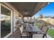 Inviting backyard patio with comfortable dining and seating areas, complemented by manicured landscaping at 12476 Heritage Bend Dr, Las Vegas, NV 89138