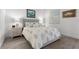 Cozy bedroom with wood-look floors, decorative art, and ample natural light at 12476 Heritage Bend Dr, Las Vegas, NV 89138