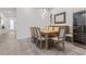 Spacious dining room features a wooden table with seating for eight and a wine fridge at 12476 Heritage Bend Dr, Las Vegas, NV 89138