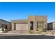 Beautiful one-story home featuring a two-car garage, stone accents, and desert landscaping at 12476 Heritage Bend Dr, Las Vegas, NV 89138