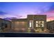 Beautiful one-story home featuring a two-car garage, stone accents, and desert landscaping at 12476 Heritage Bend Dr, Las Vegas, NV 89138