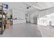 Organized garage with ample cabinet storage, epoxy floors, and shelving, great for organization at 12476 Heritage Bend Dr, Las Vegas, NV 89138