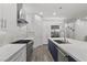Spacious modern kitchen with stainless steel appliances, a gas range, and large kitchen island at 12476 Heritage Bend Dr, Las Vegas, NV 89138