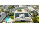 Aerial view of a house featuring solar panels, a sparkling pool, and an outdoor living area at 2212 Marble Gorge Dr, Las Vegas, NV 89117