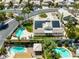 Aerial view of a backyard with a freeform pool, patio, and lush landscaping, ideal for outdoor living at 2212 Marble Gorge Dr, Las Vegas, NV 89117