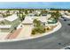 An aerial view of a house with a well-manicured front yard, white tile roof, and desert landscaping at 2212 Marble Gorge Dr, Las Vegas, NV 89117