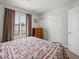 Bedroom featuring a bed, nightstand, dresser and large window with natural light at 2212 Marble Gorge Dr, Las Vegas, NV 89117