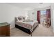 Bedroom with a bed, nightstand and large window with natural light at 2212 Marble Gorge Dr, Las Vegas, NV 89117