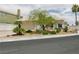 Charming single-story home showcasing a well-manicured front yard and attached two-car garage at 2212 Marble Gorge Dr, Las Vegas, NV 89117