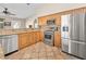 Well-equipped kitchen with stainless steel appliances, granite countertops, and ample cabinet space at 2212 Marble Gorge Dr, Las Vegas, NV 89117