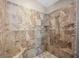 Tiled walk-in shower featuring a showerhead and corner seat at 2212 Marble Gorge Dr, Las Vegas, NV 89117