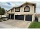 Two-story home featuring a three-car garage, stucco exterior, and arched windows at 2816 Via Bel Mondo St, Henderson, NV 89074