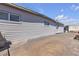 House exterior showing gray siding and concrete patio, enhancing the home's outdoor appeal at 326 W Basic Rd, Henderson, NV 89015
