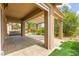 Back patio covered by a pergola, featuring pavers, artificial grass, and landscaping at 3528 Tack St, Las Vegas, NV 89122