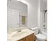 Bright bathroom featuring a vanity, mirror, toilet, and a bathtub with shower at 3528 Tack St, Las Vegas, NV 89122