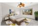 Bright bedroom with a large window, ceiling fan, and stylish decor, creating a serene retreat at 3528 Tack St, Las Vegas, NV 89122
