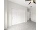 Bedroom with gray carpet, neutral walls, and a closet with sliding doors at 3528 Tack St, Las Vegas, NV 89122