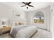 Bedroom features bed, soft lighting, and arched window at 3528 Tack St, Las Vegas, NV 89122