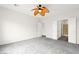 Spacious bedroom with neutral walls and carpet, ceiling fan, and en-suite bath at 3528 Tack St, Las Vegas, NV 89122