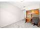 Empty bedroom features gray carpet, desk, and window at 3528 Tack St, Las Vegas, NV 89122